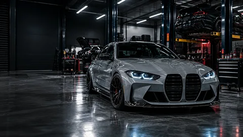 Rated M Performance workshop with a BMW M car on the hoist