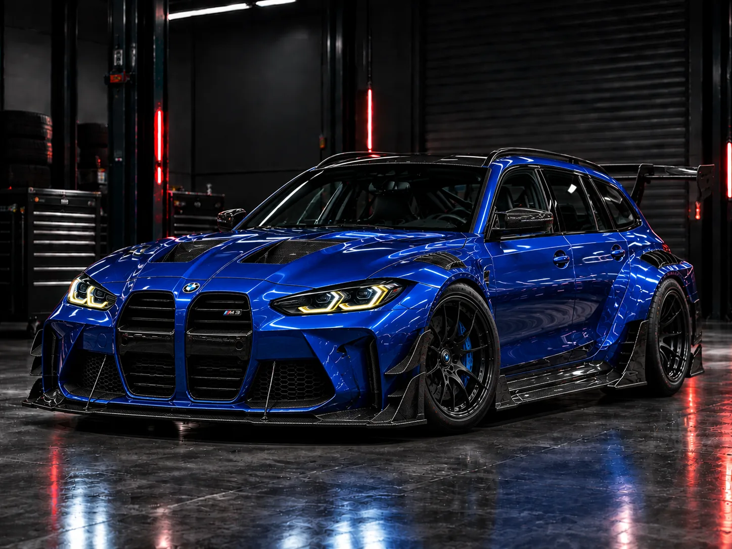 Blue performance estate with widebody conversion in the workshop